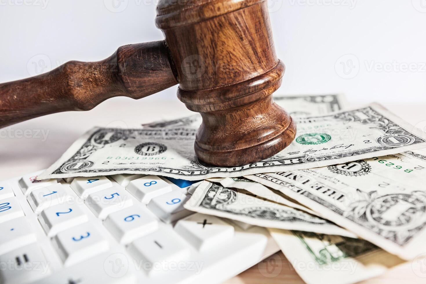 judge gavel and money on brown wooden table concept photo