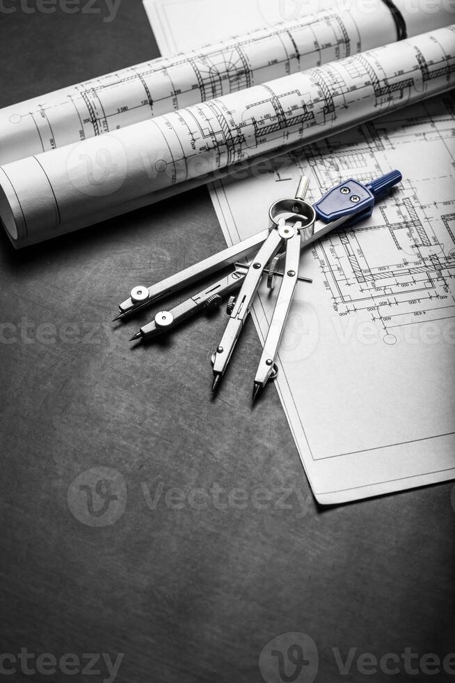 Construction planning drawings on black background photo