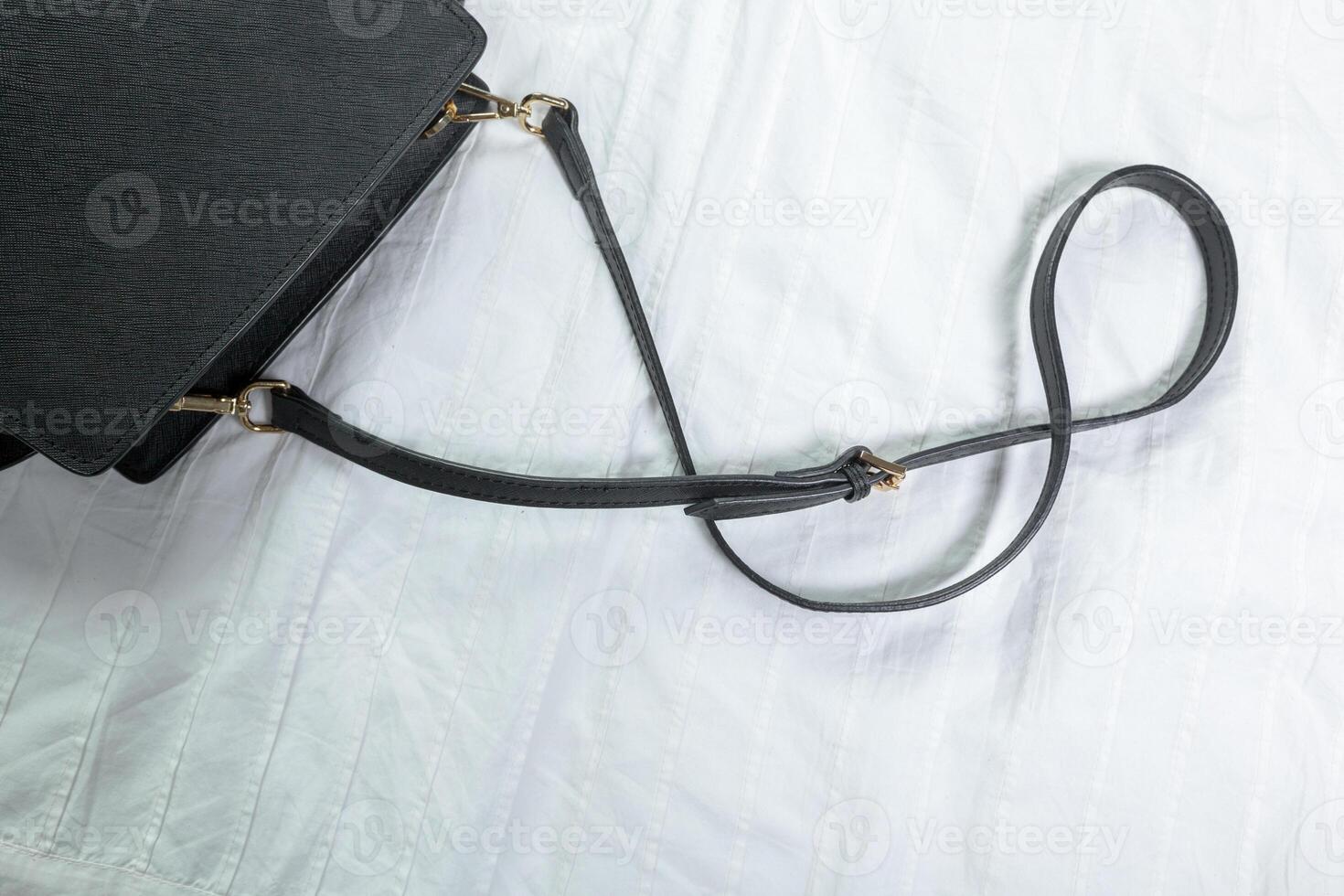 Female bag on white textile photo