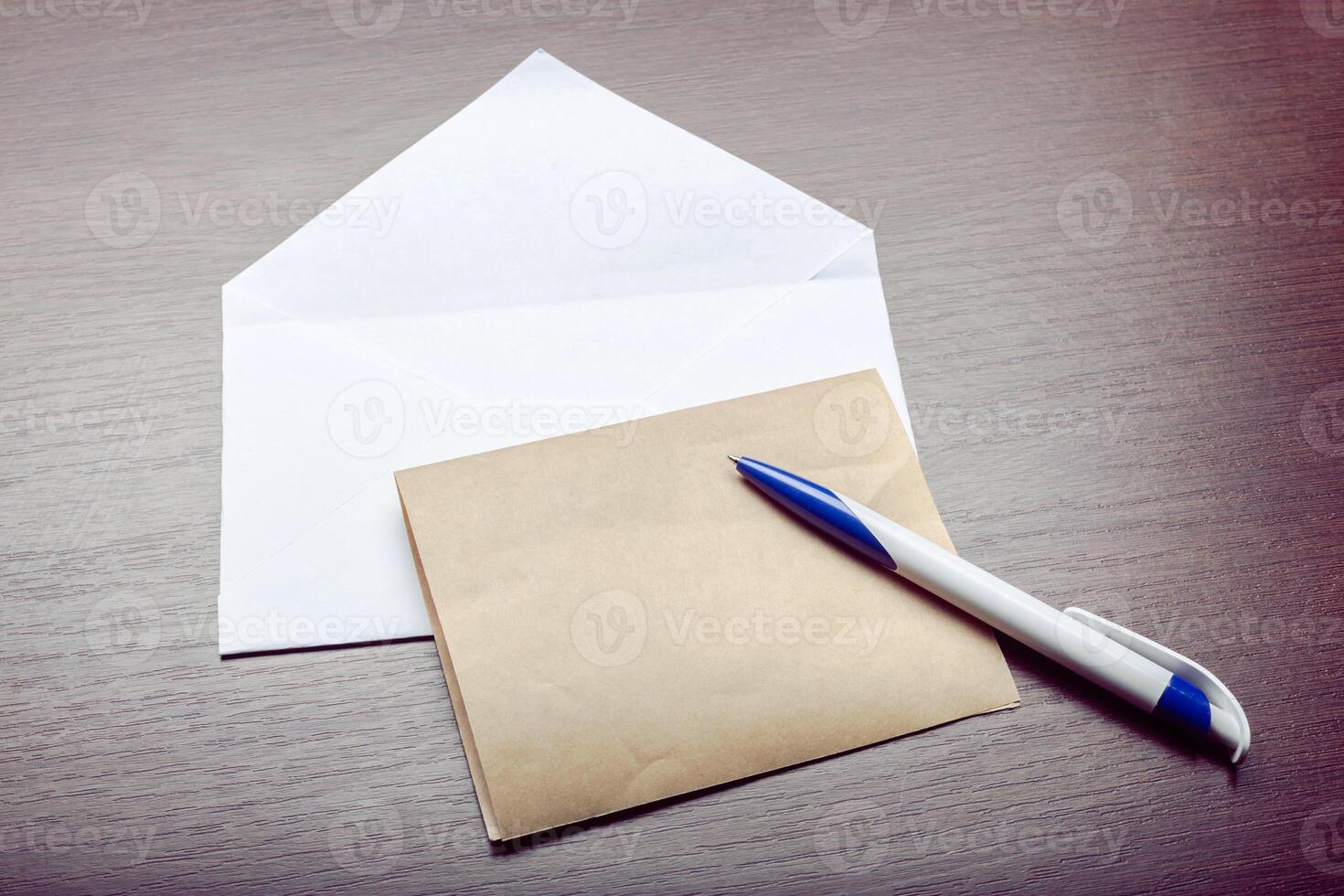 Photo of blank envelope on a wooden background