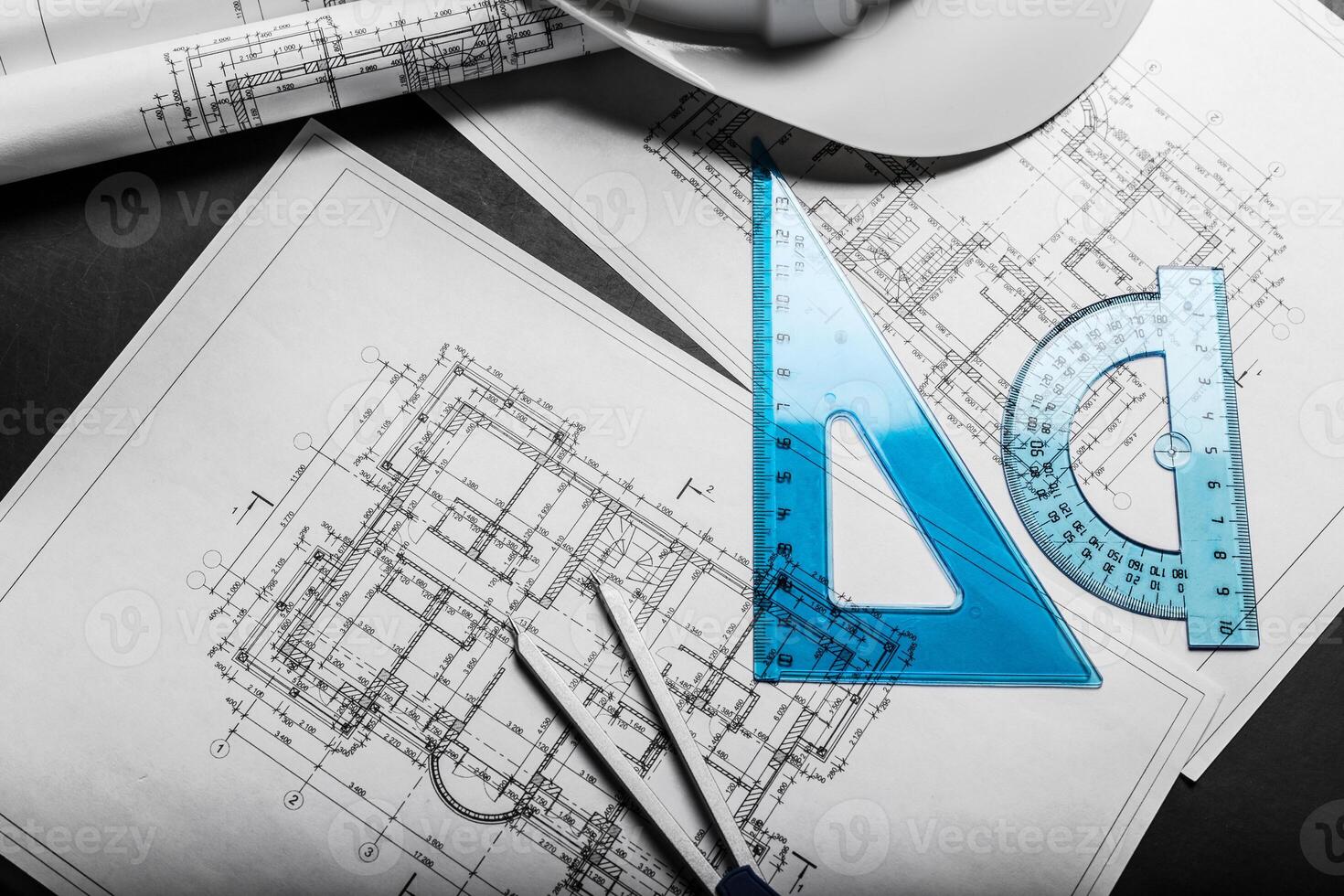 Construction planning drawings on black background photo