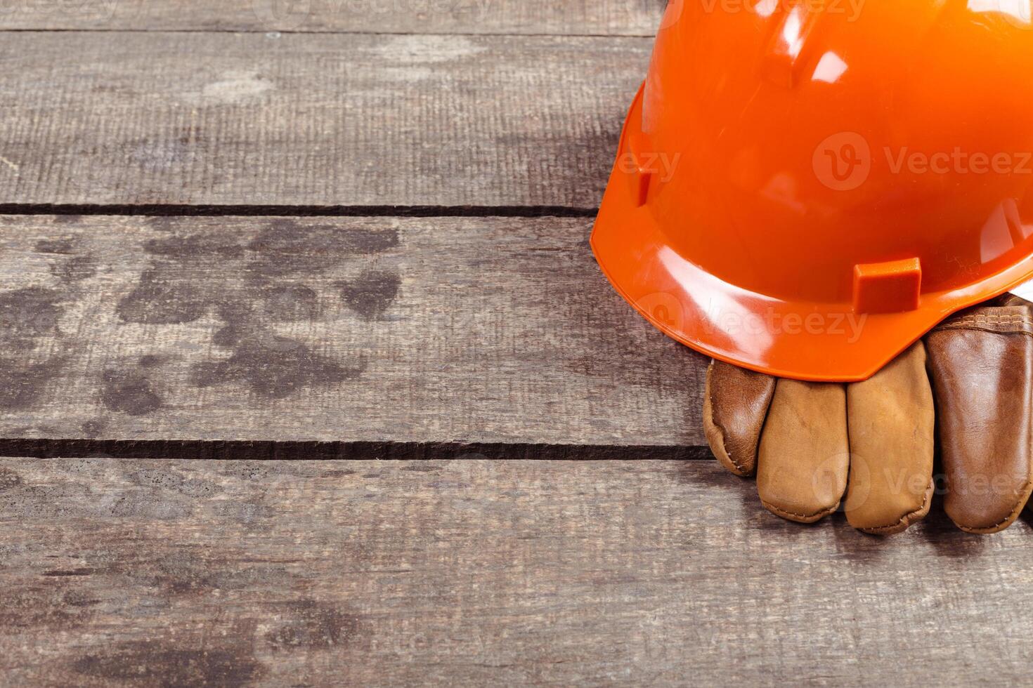 hardhat and old leather gloves photo