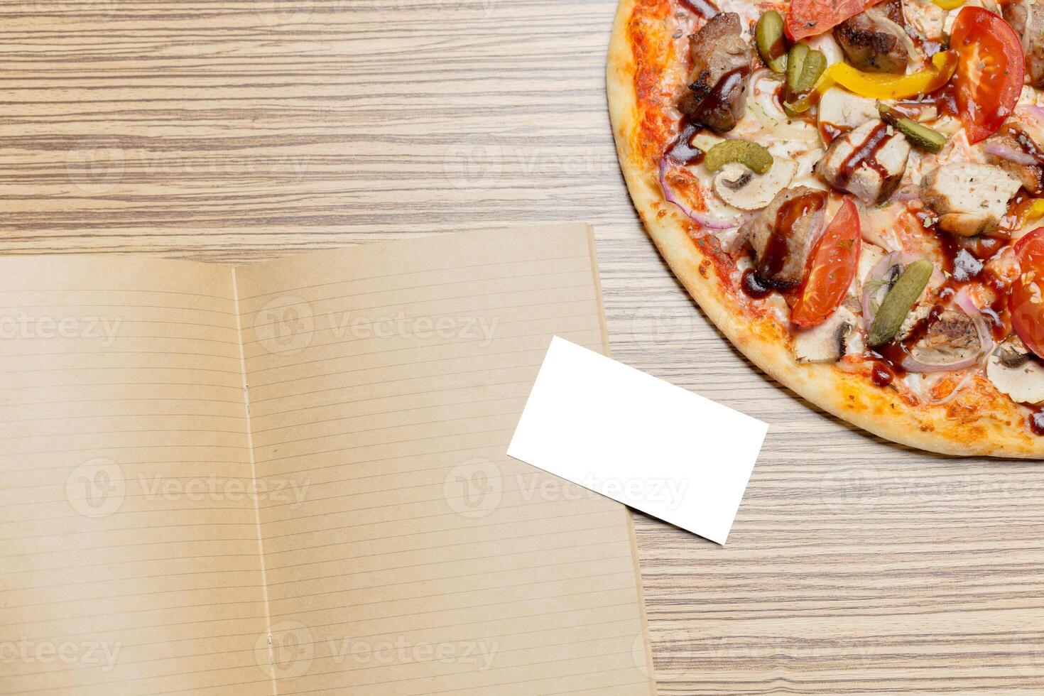Pizza with blank paper with copy space photo
