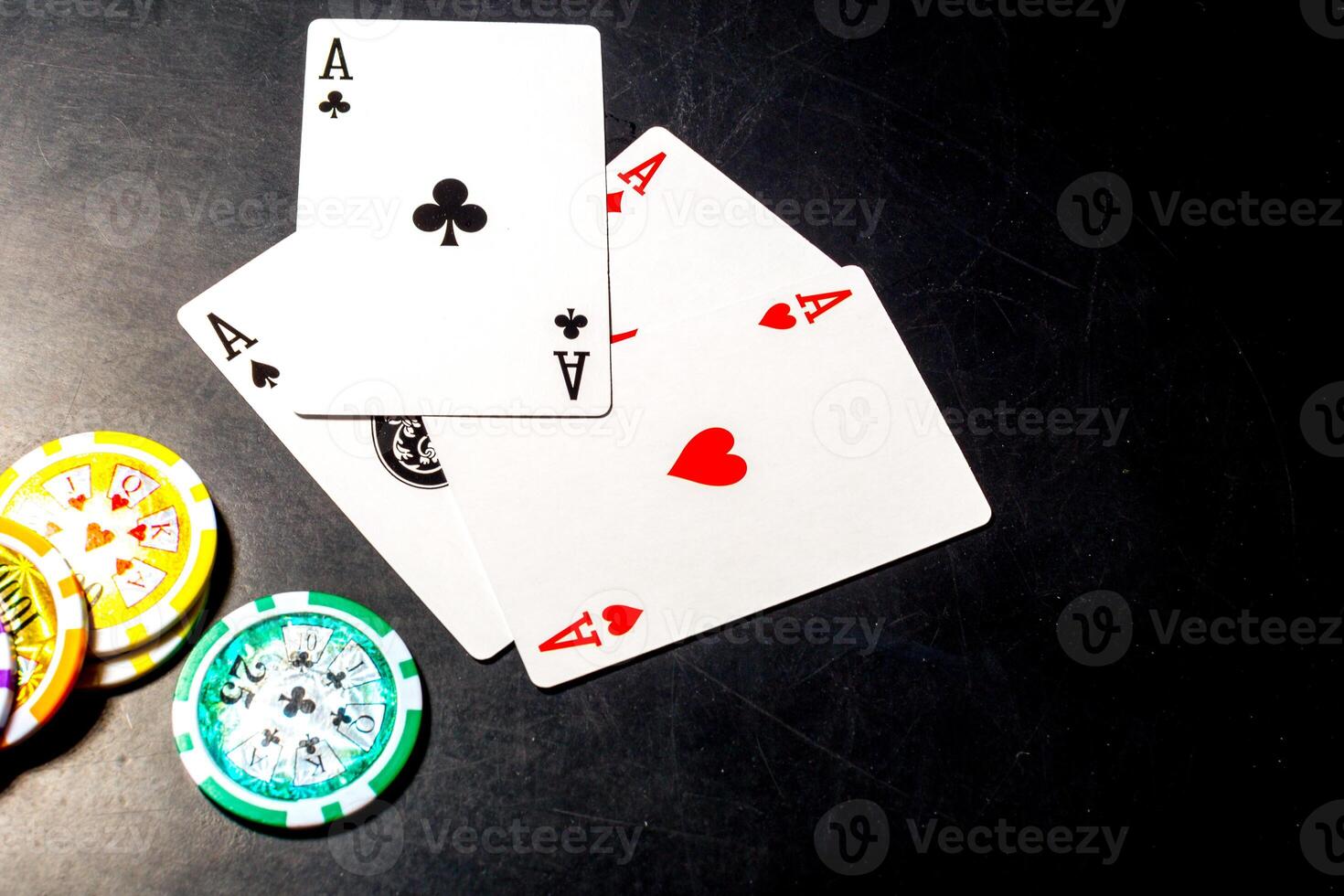 poker chips and cards on black background photo