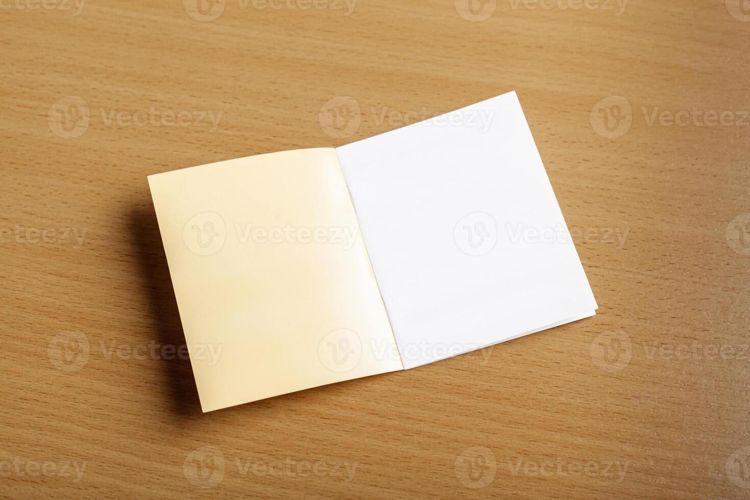 Open notebook on the wooden floor. photo
