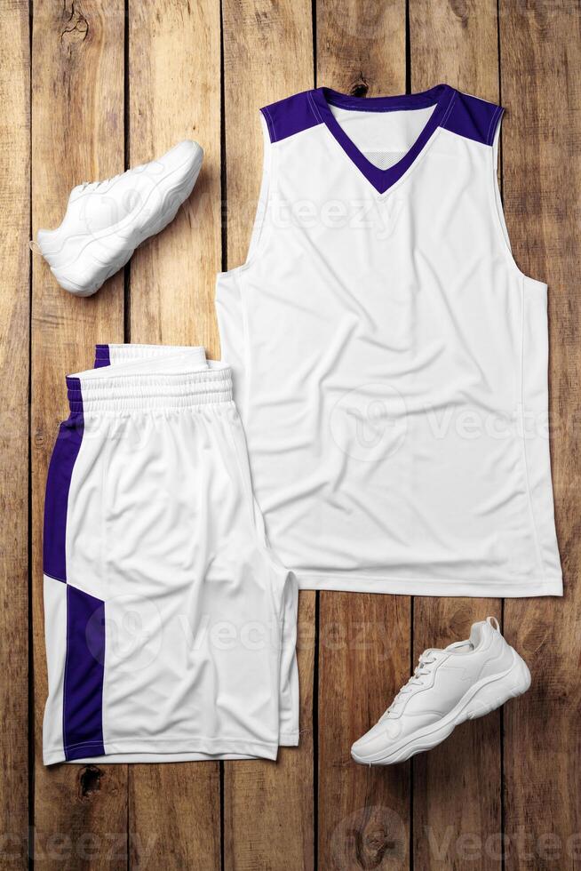 Basketball uniform on wooden background top view photo