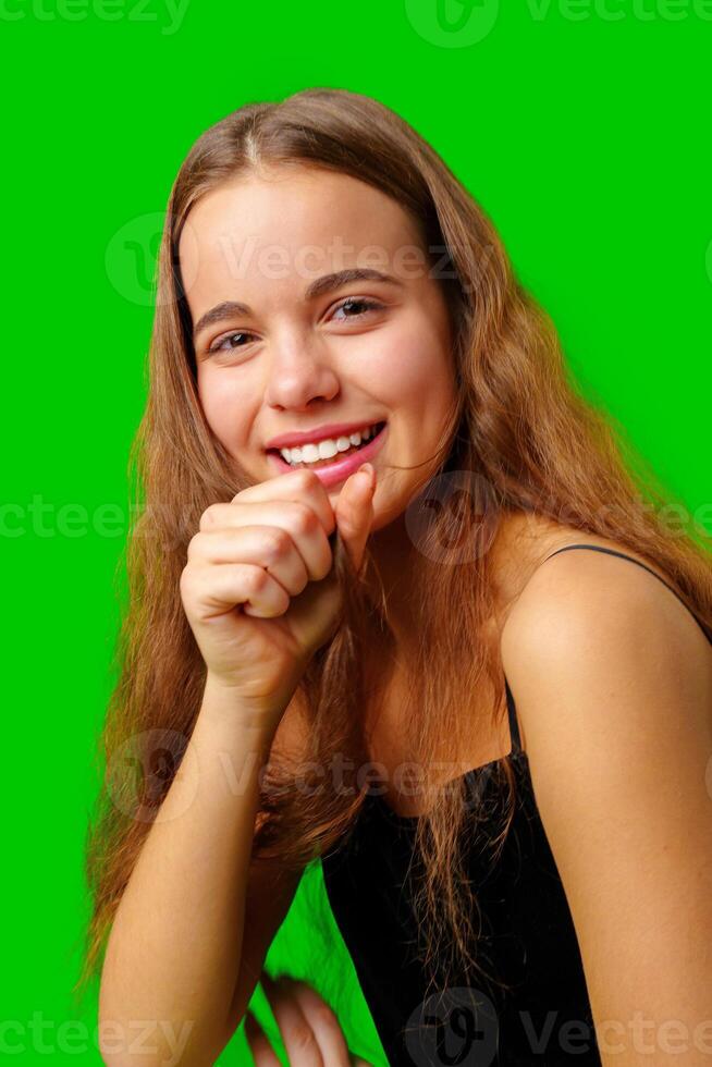 Smiling Young Woman in Black Top and Tan Pants Portrait photo