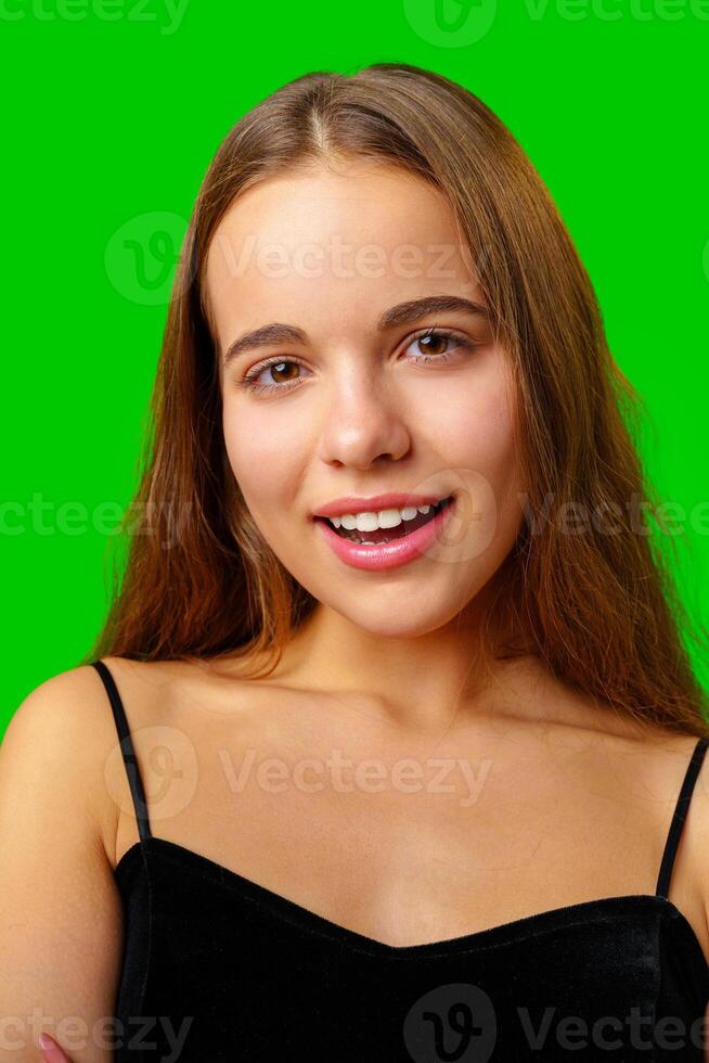 Smiling Young Woman in Black Top and Tan Pants Portrait photo