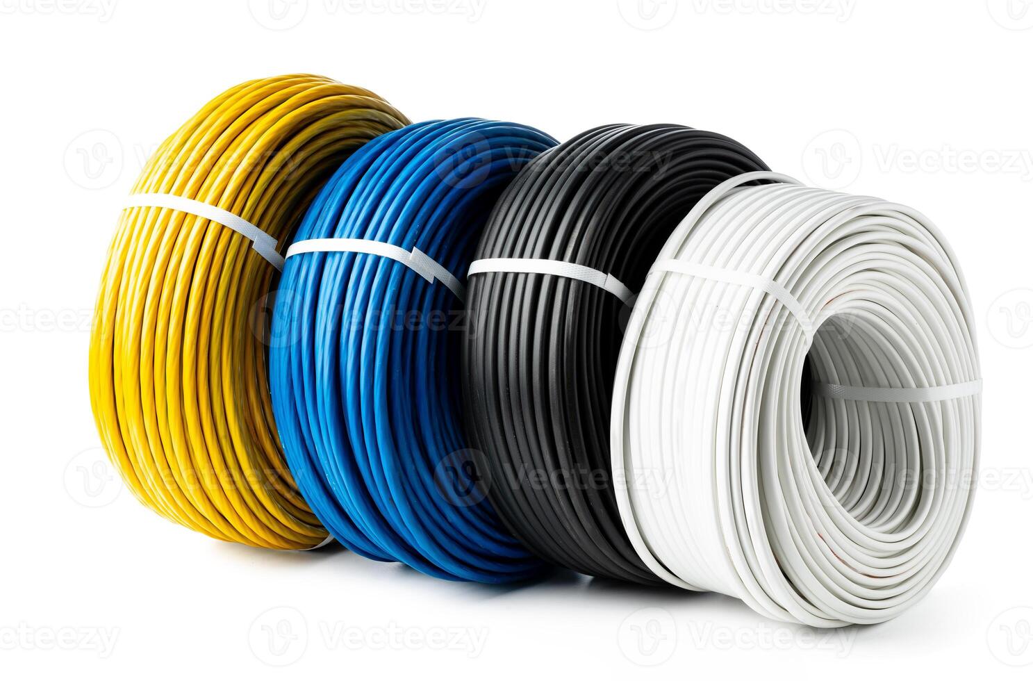 Four Spools of Electrical Wire in Yellow, Blue, Black, and White Colors. A Close-Up Photo of Four Spools of Electrical Wire, Each Wound in a Different Color.