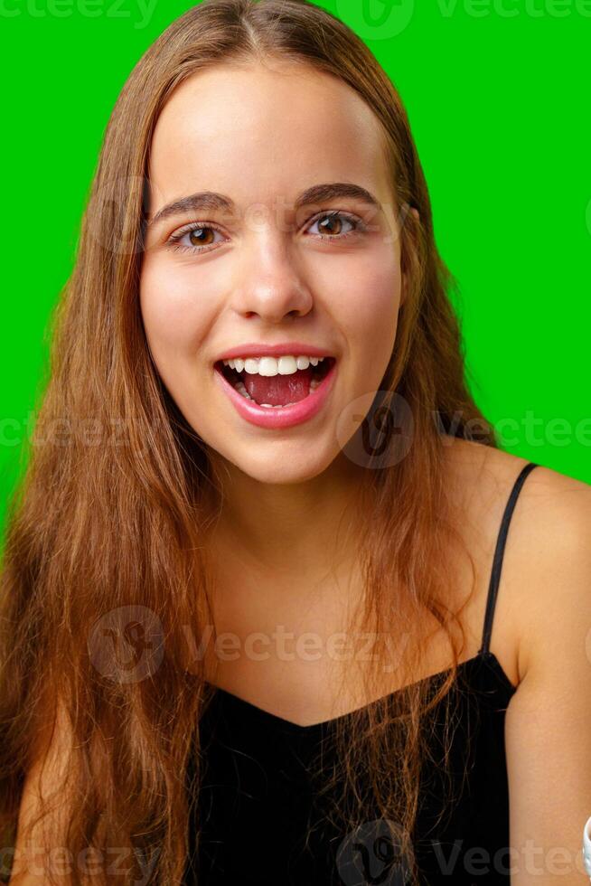 Smiling Young Woman in Black Top and Tan Pants Portrait photo