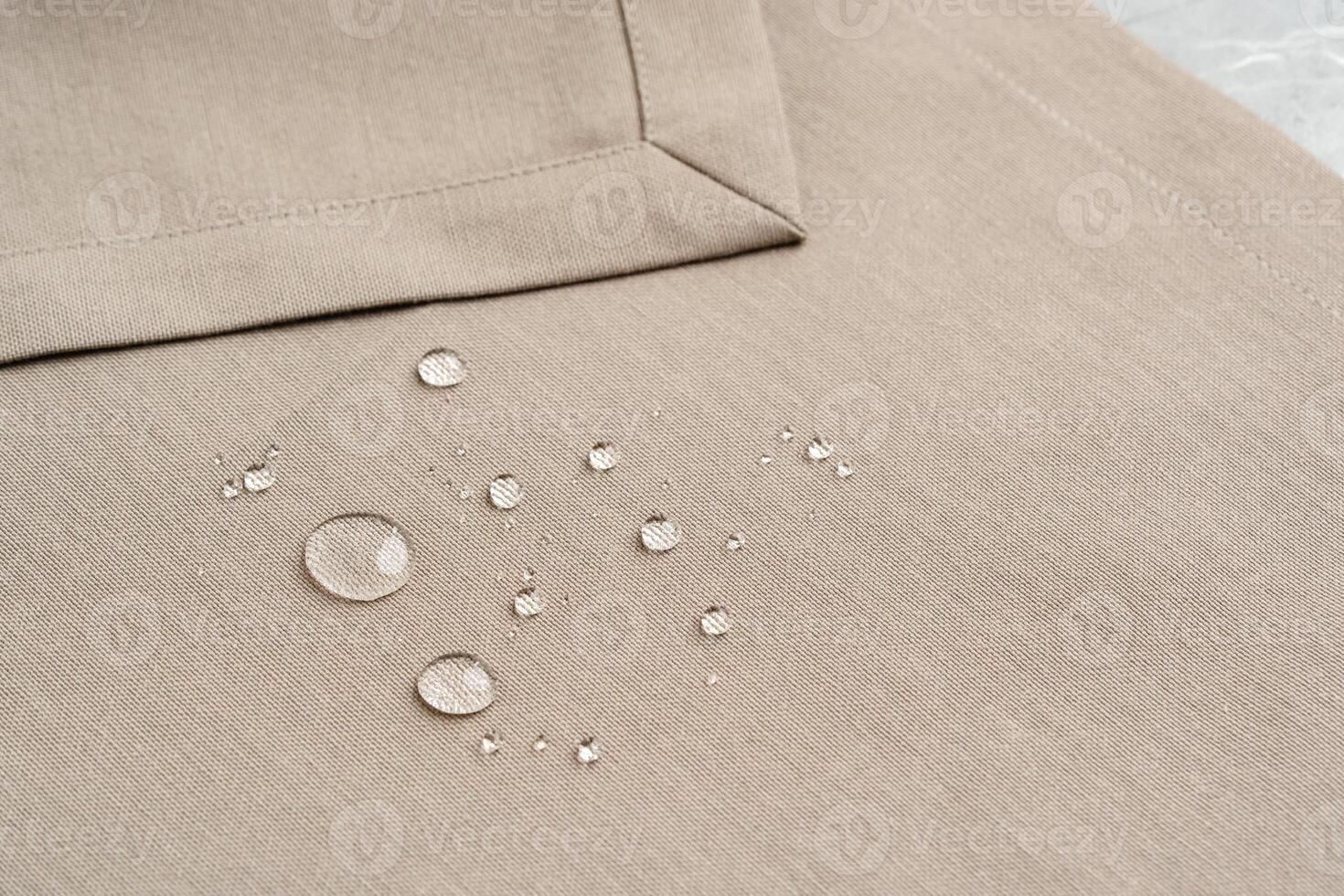 Water Droplets on Beige Fabric Surface Close Up photo