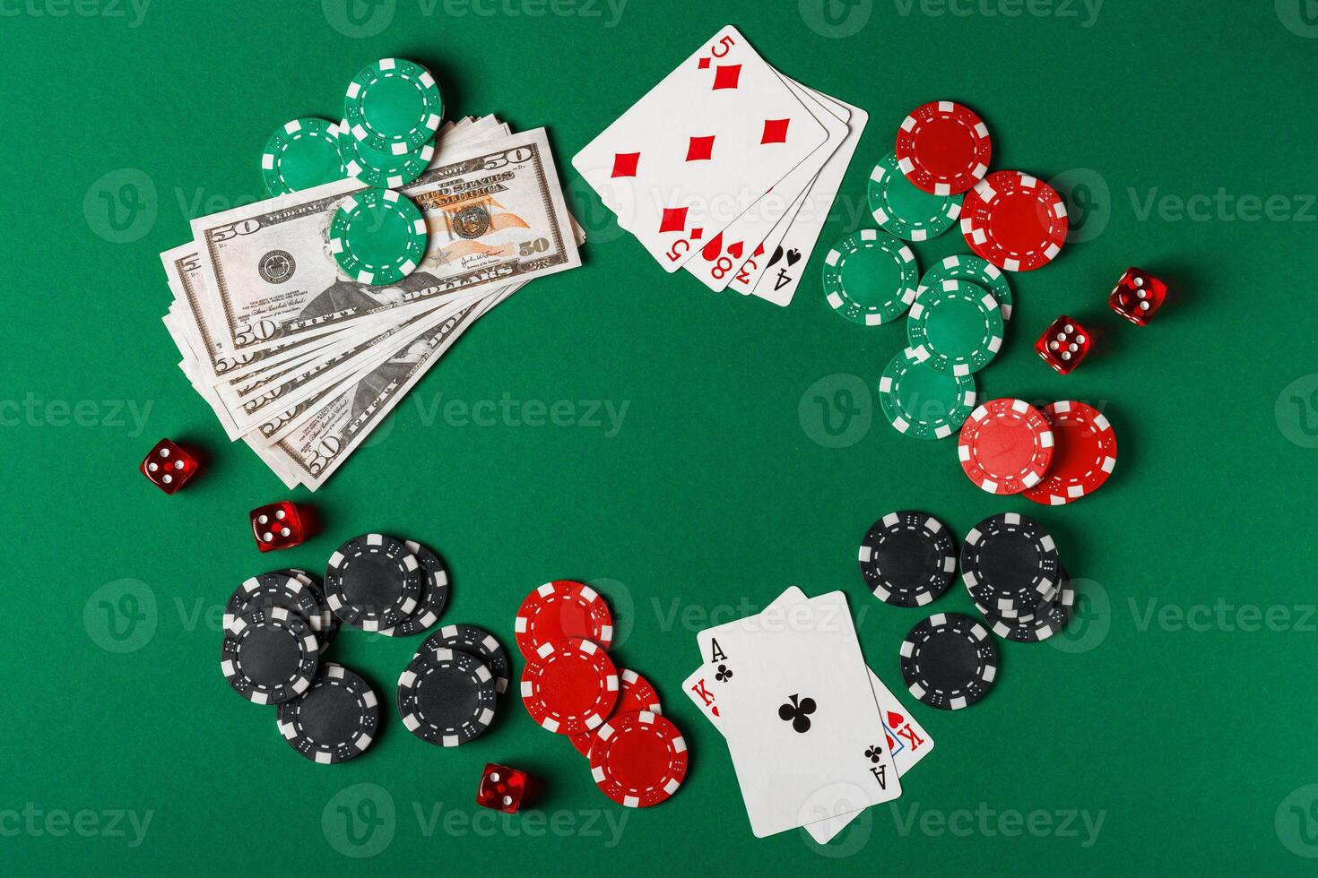 Red Dice, Playing Cards, and Chips on Green Felt Tabletop photo