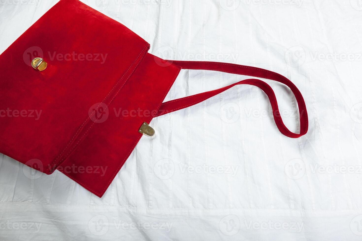 Female bag on white textile photo