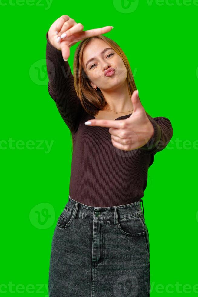 Young Woman Making A Framing Gesture With Her Fingers photo