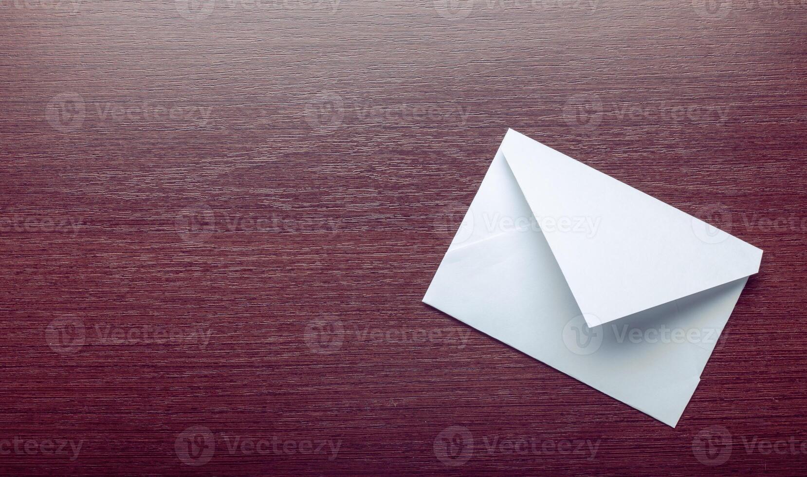 Photo of blank envelope on a wooden background