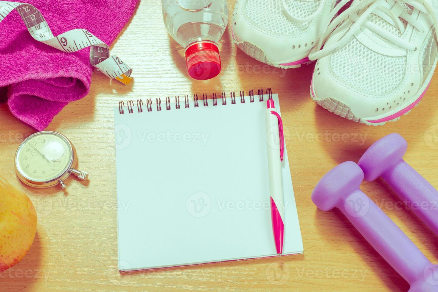 Shoes and sports equipment on wooden floor, top view photo