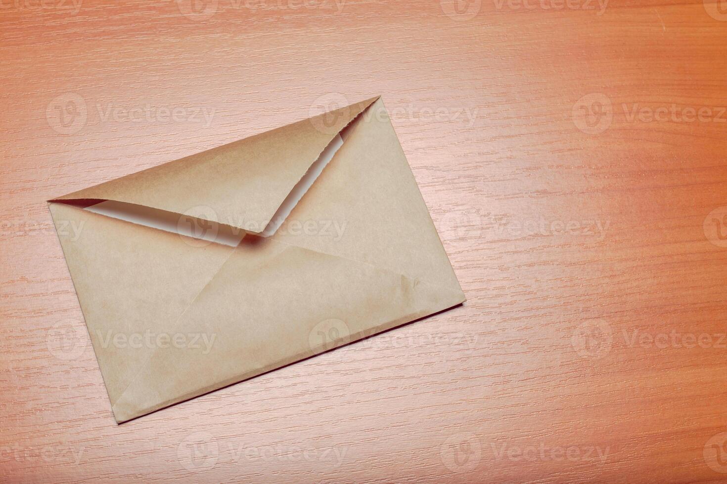 Photo of blank envelope on a wooden background