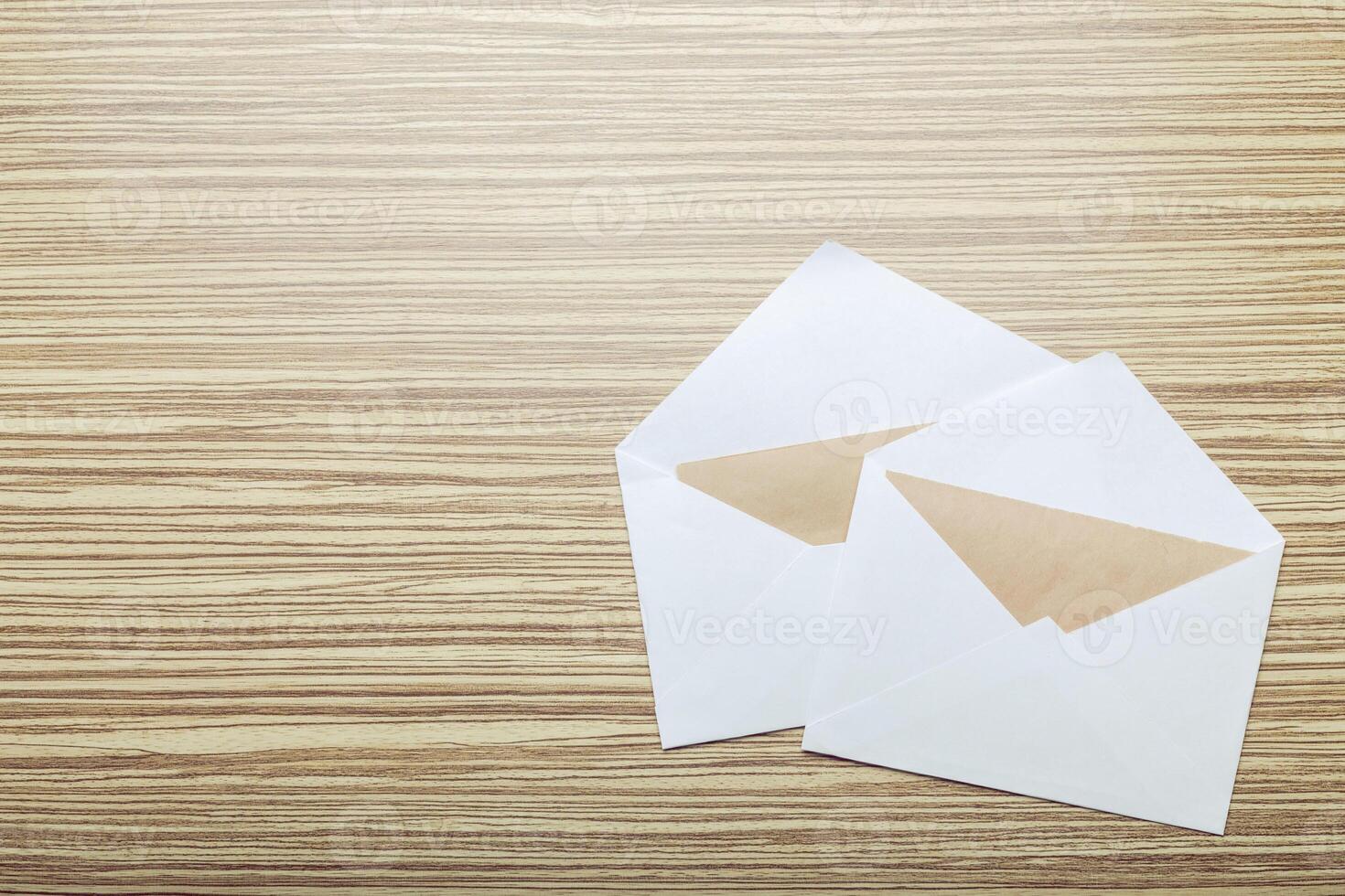 Photo of blank envelope on a wooden background