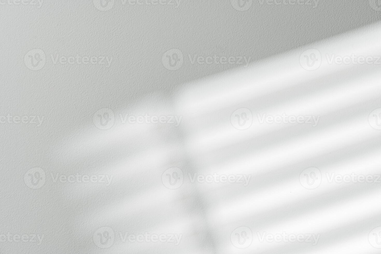 Gray background with shadows and light from window photo