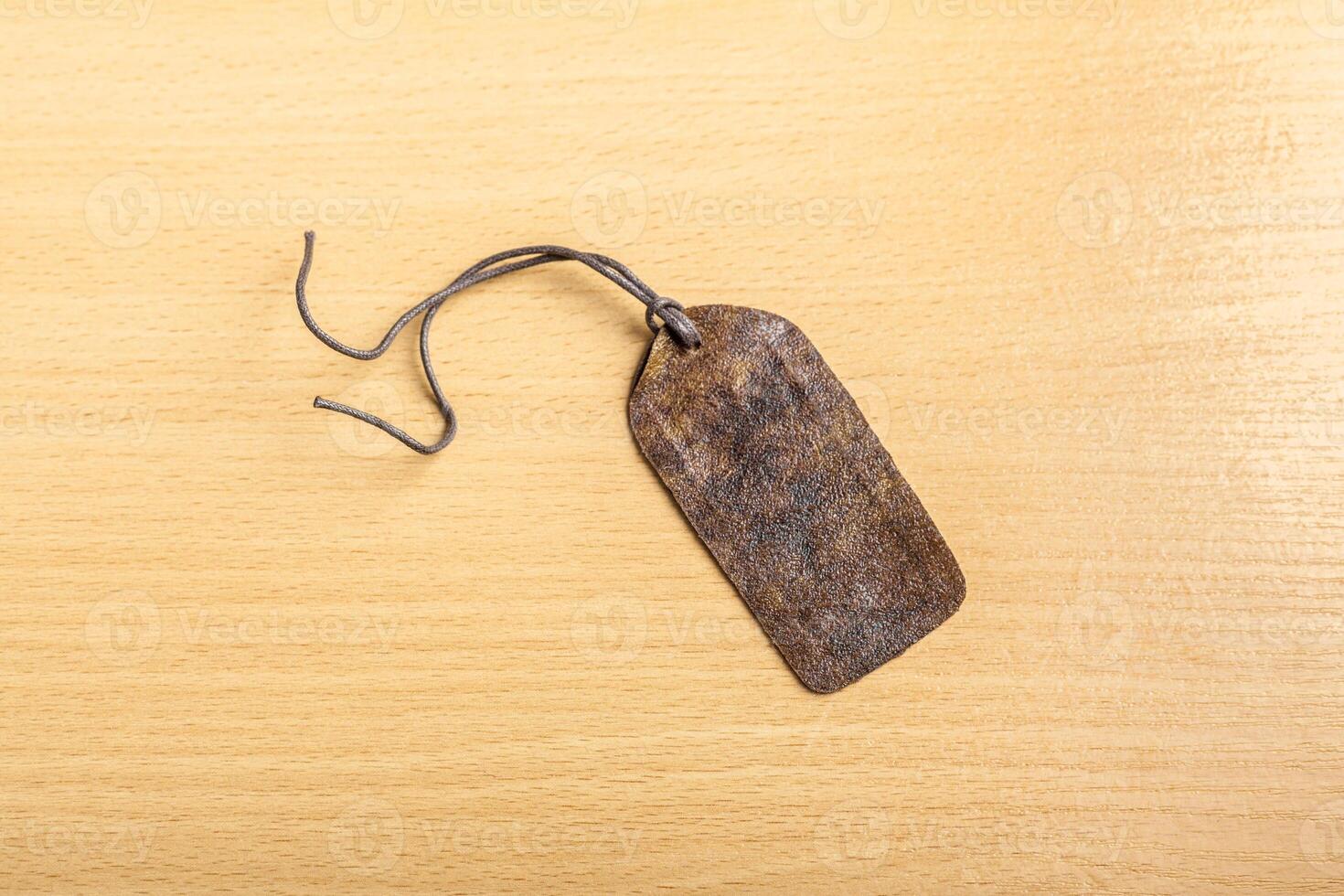Blank tag on wooden background photo