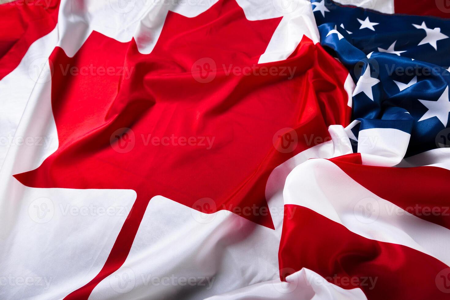 American and Canadian flags together photo