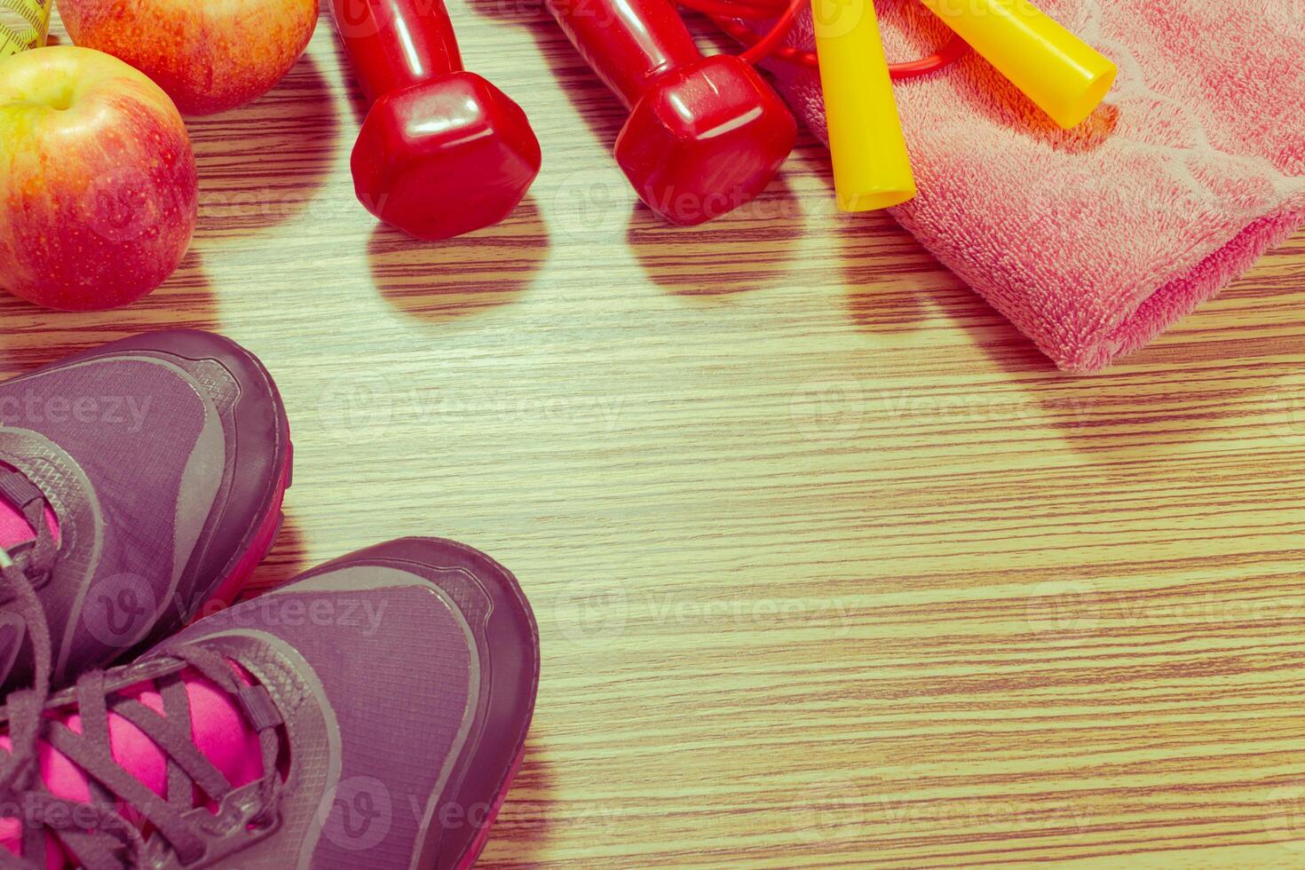 Shoes and sports equipment on wooden floor, top view photo