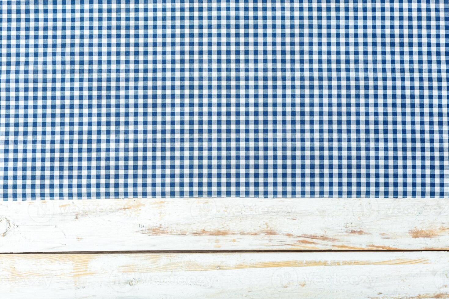 Tablecloth textile on wooden background photo