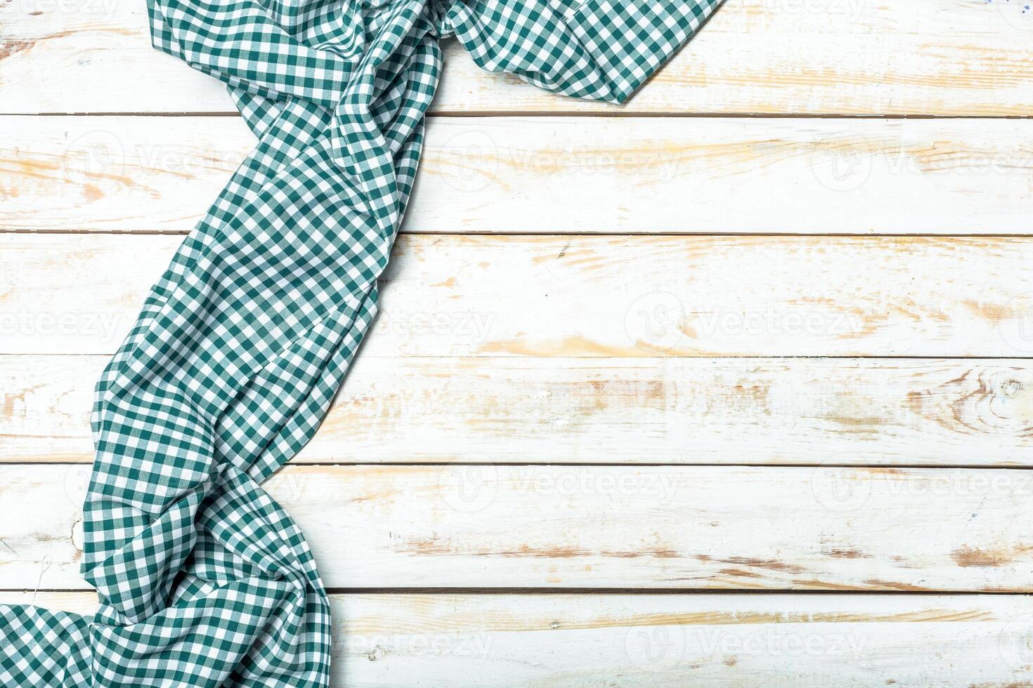 Tablecloth textile on wooden background photo