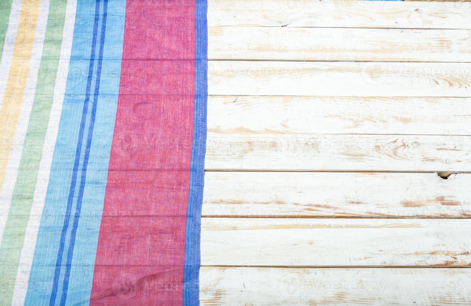 Tablecloth textile on wooden background photo