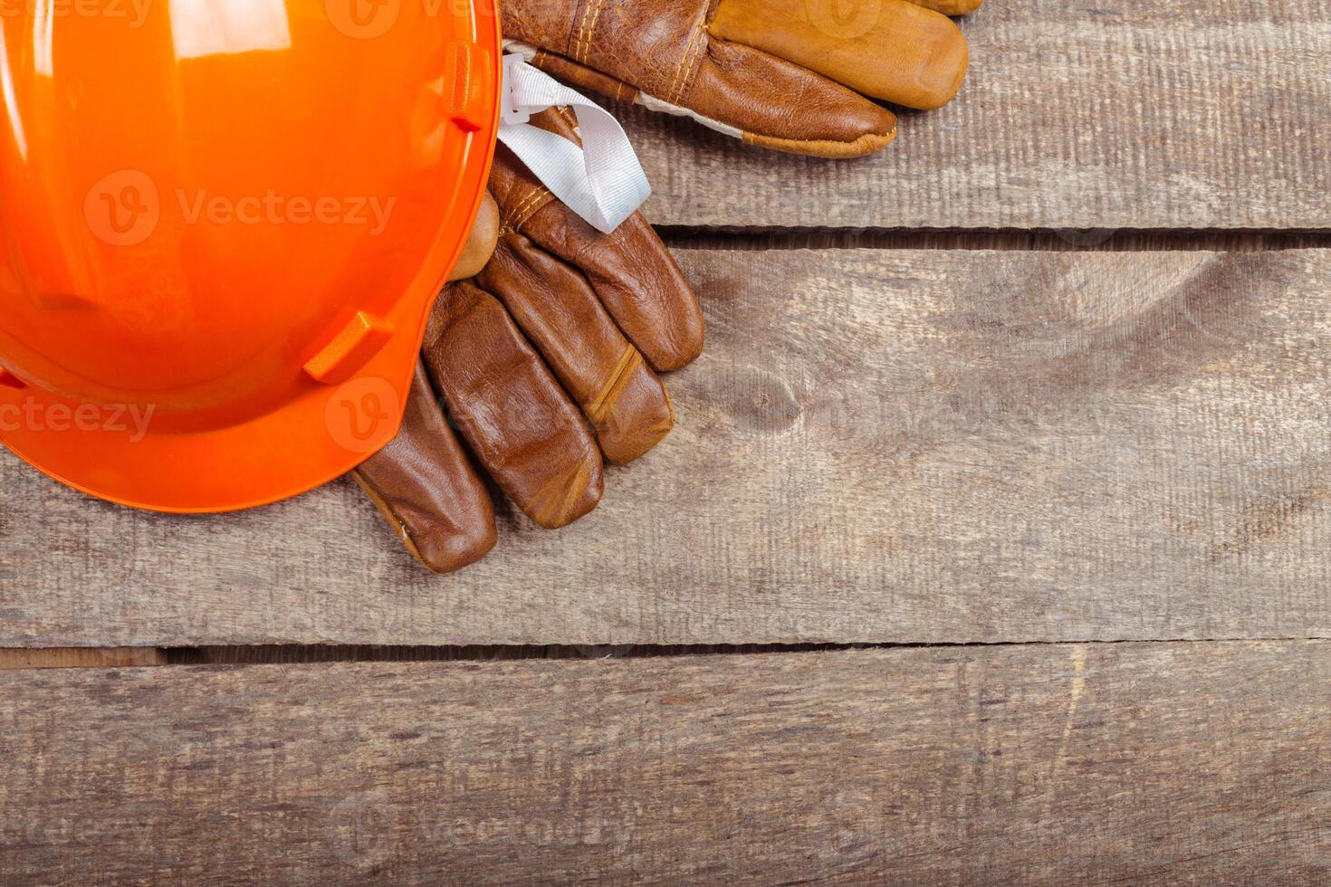 hardhat and old leather gloves photo