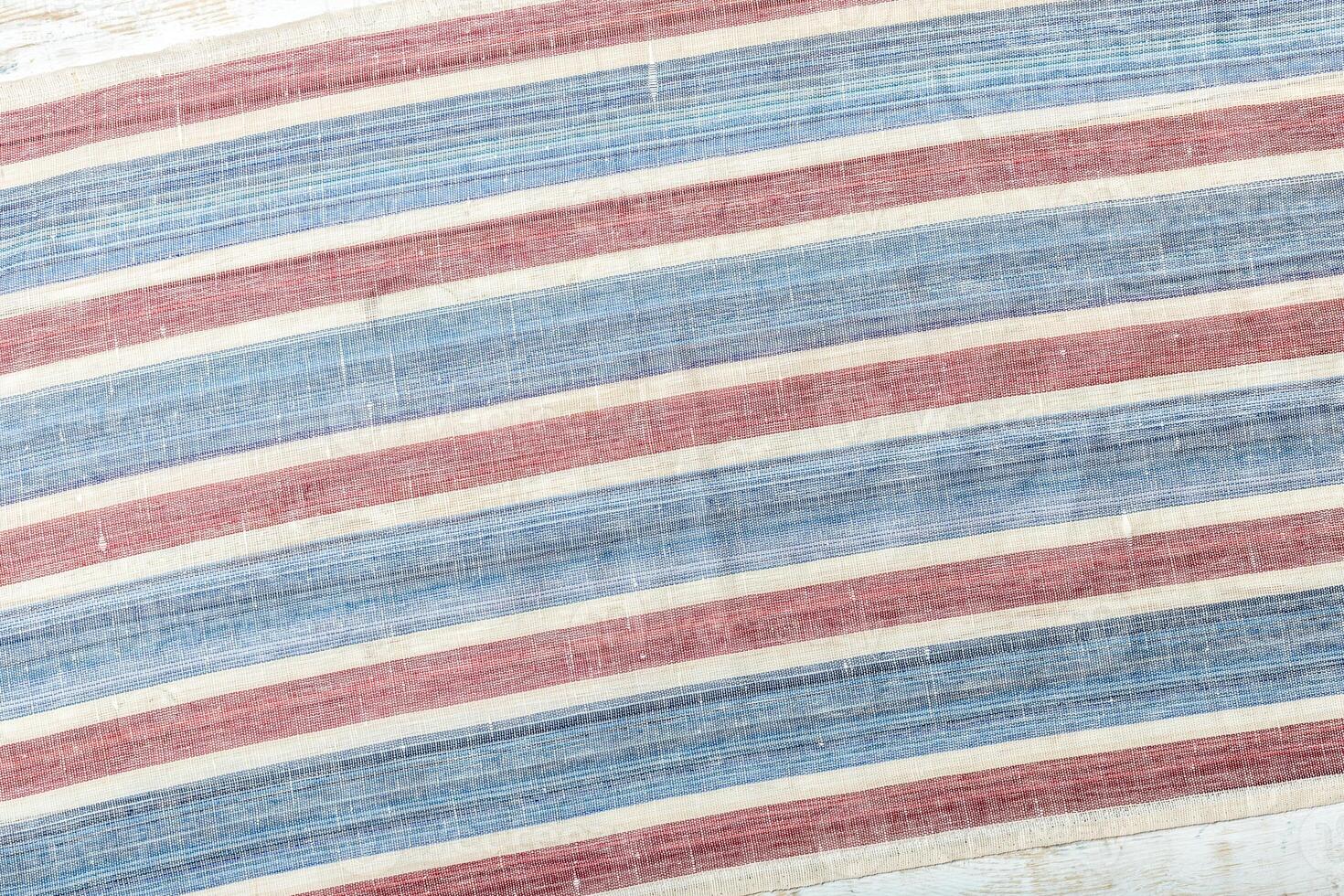 Tablecloth textile on wooden background photo