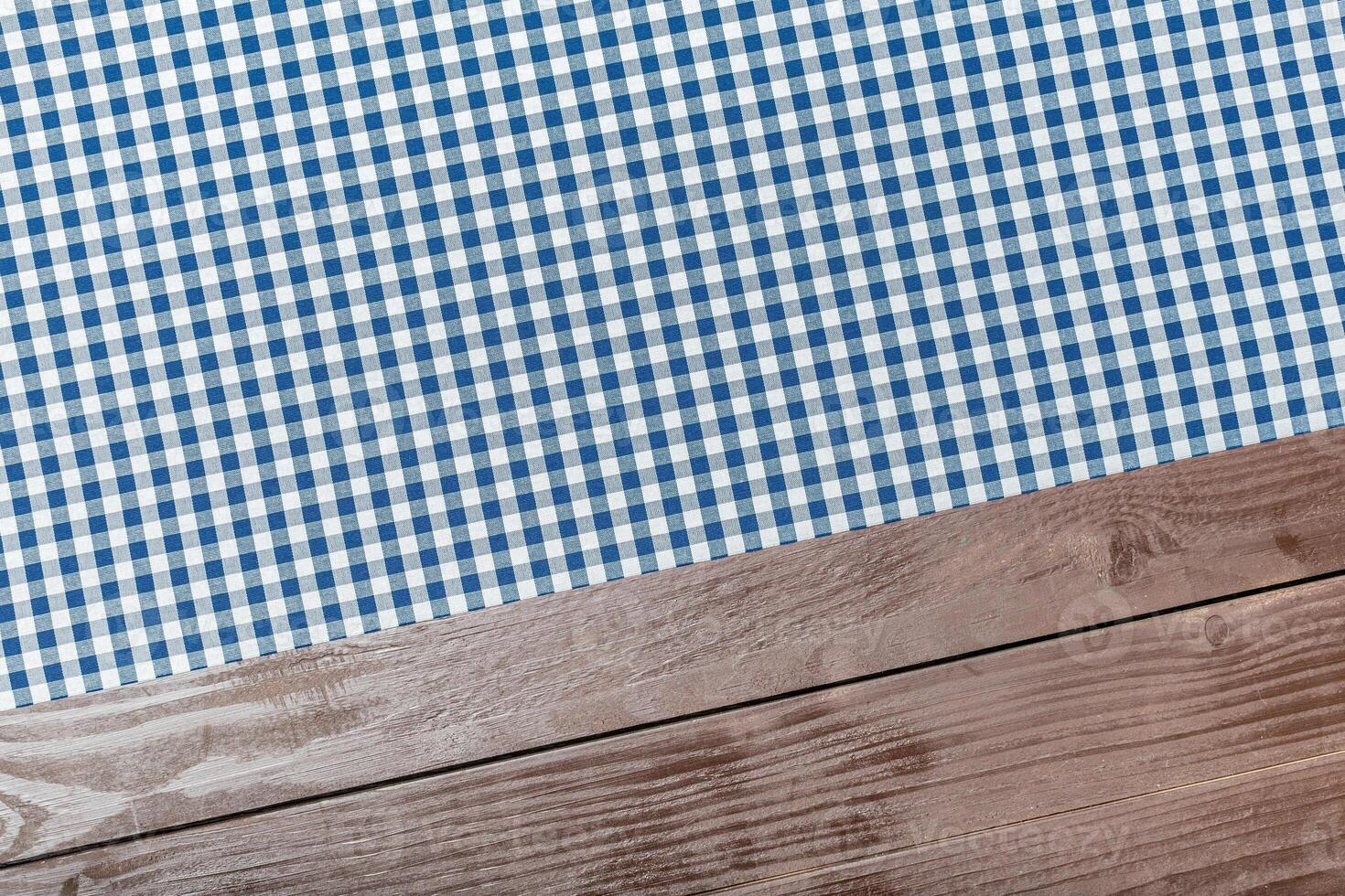 Tablecloth textile on wooden background photo