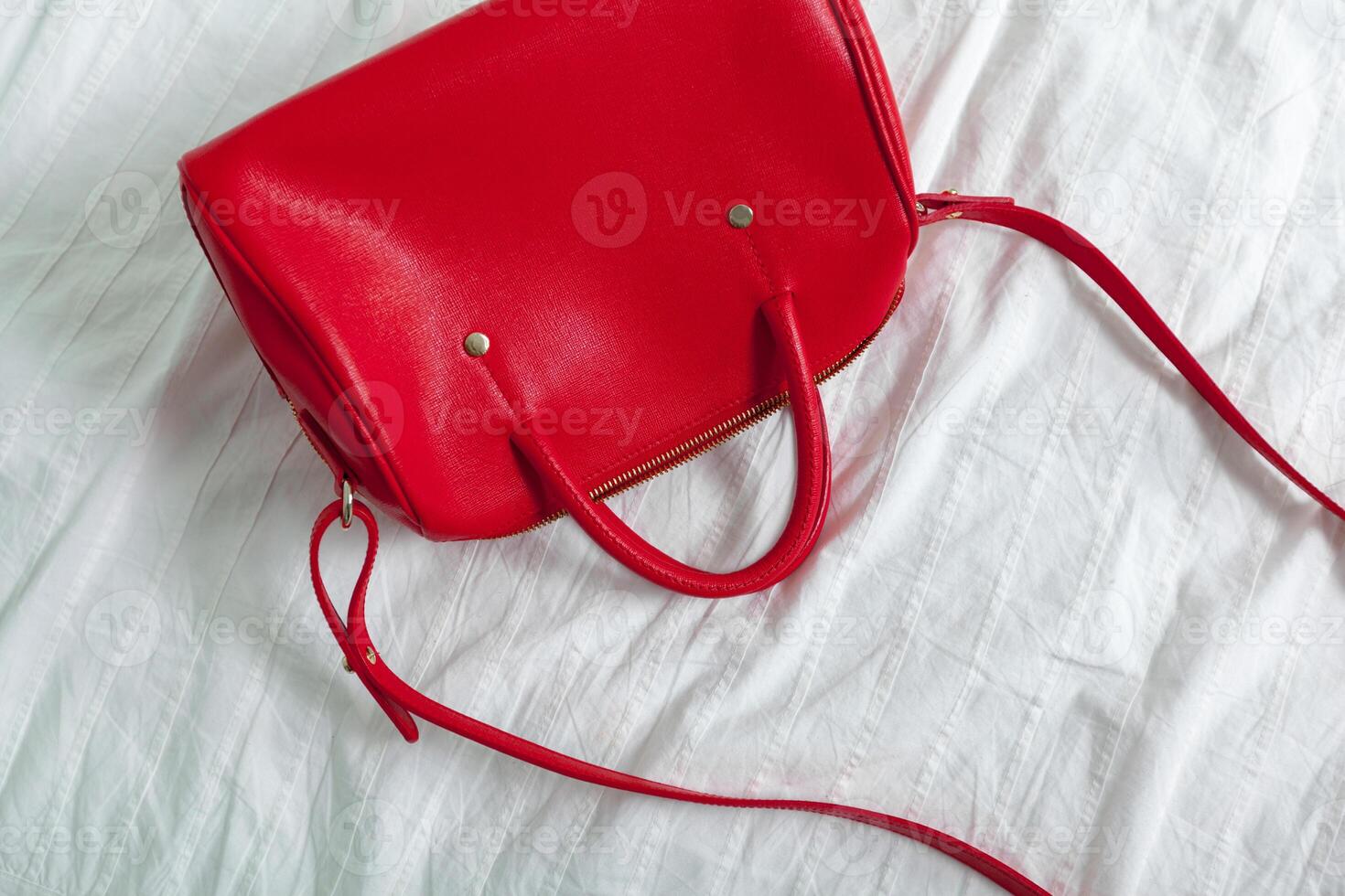 Female bag on white textile photo