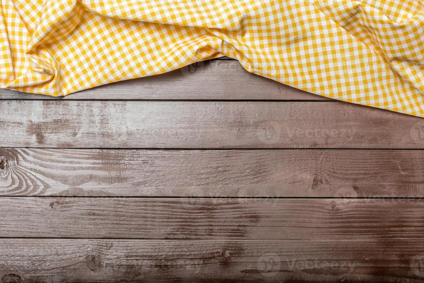 Tablecloth textile on wooden background photo