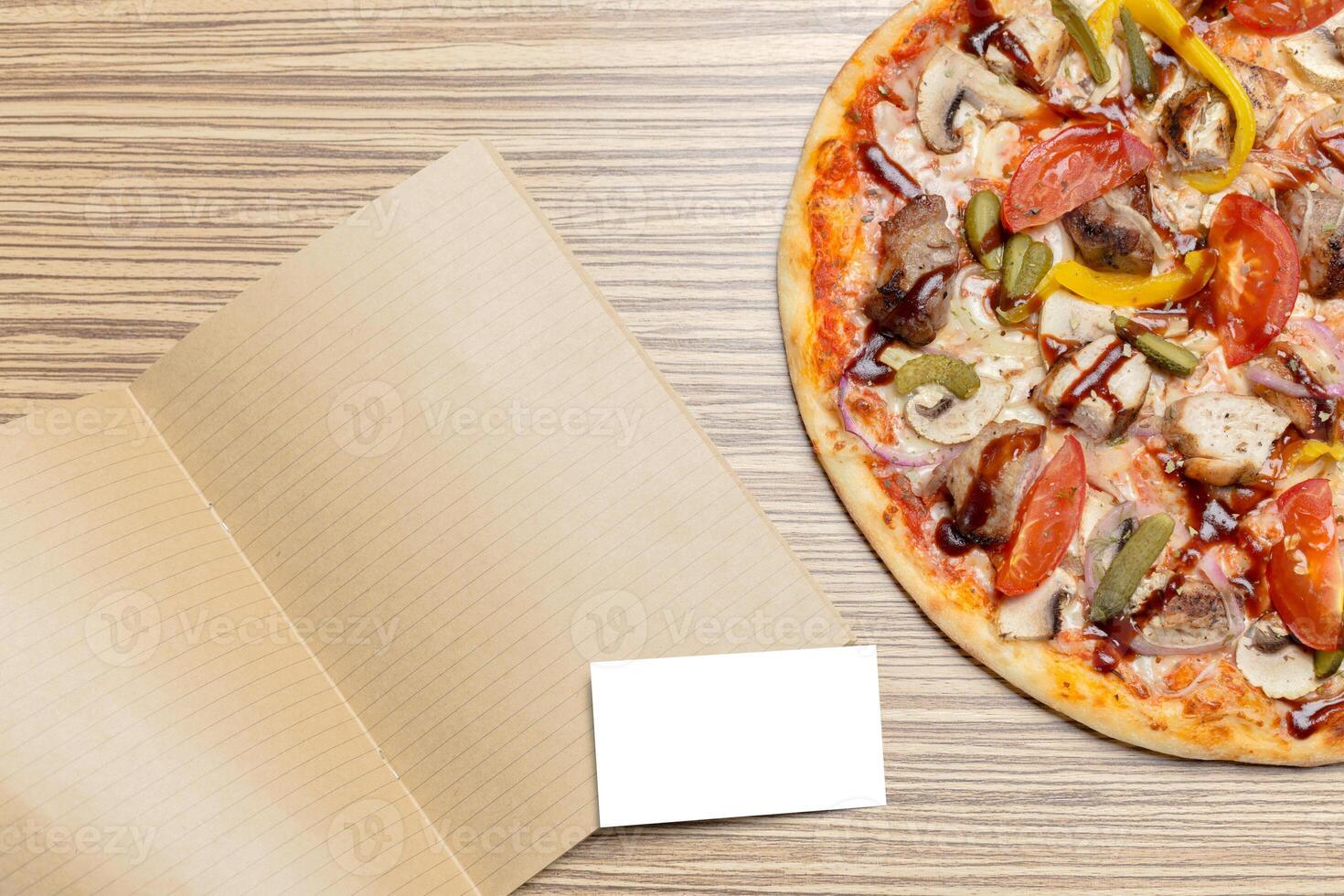 Pizza with blank paper with copy space photo