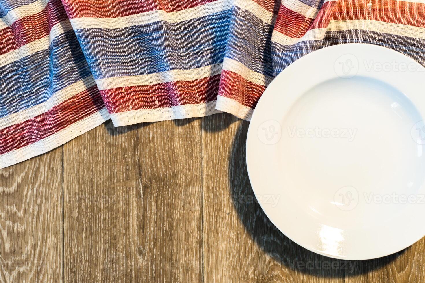 White Plate on a Tablecloth photo