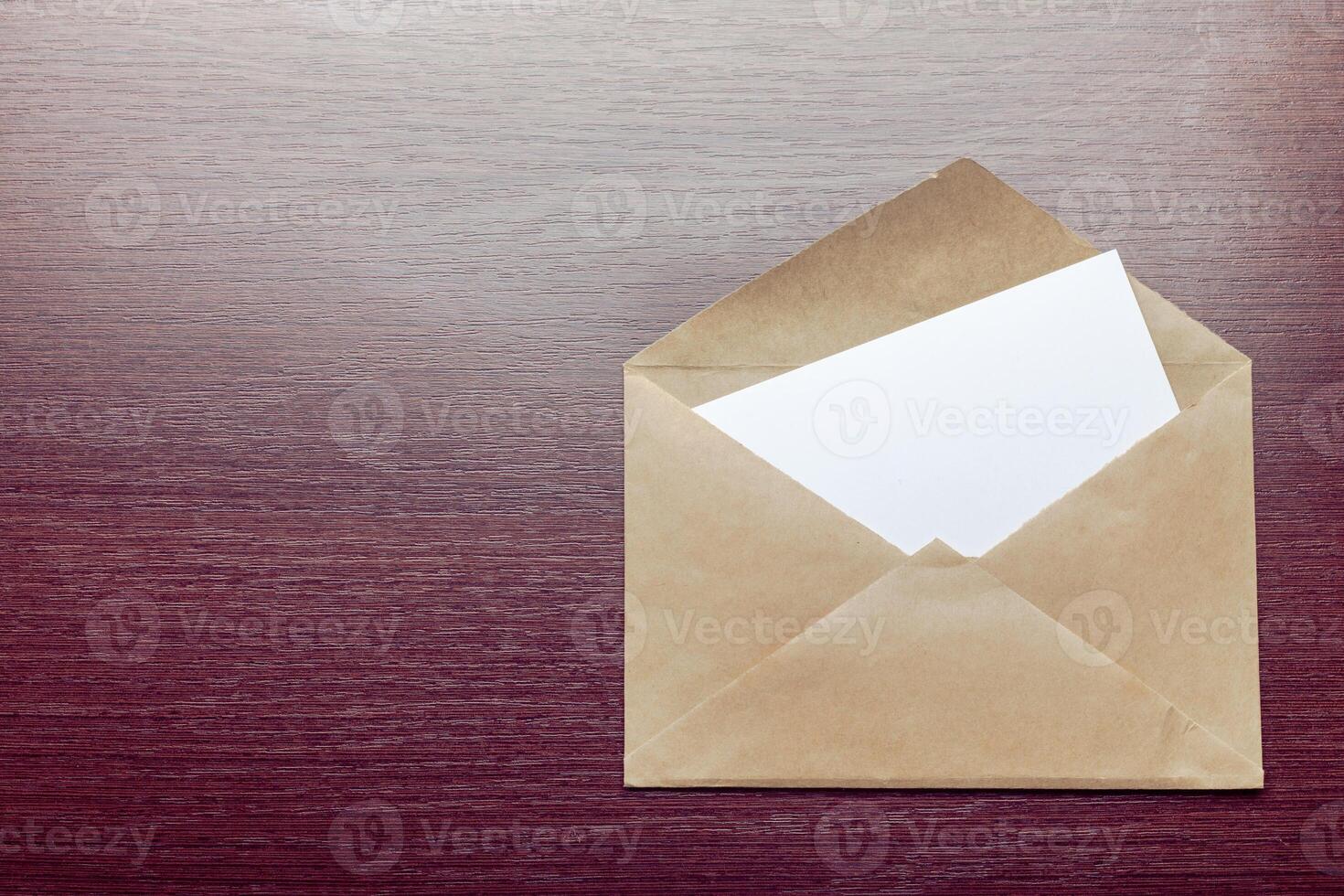 Photo of blank envelope on a wooden background
