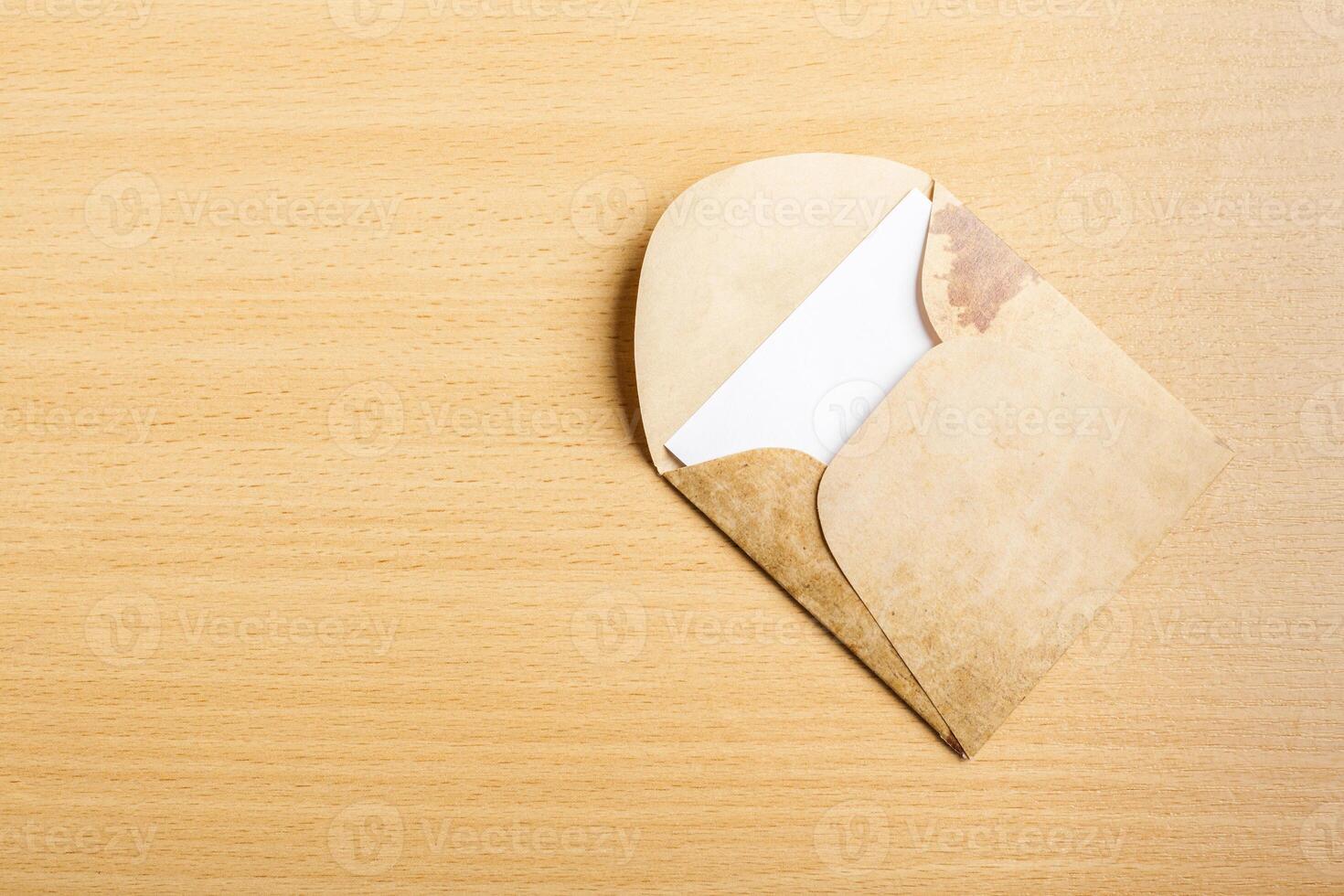 envelope whit blank on wooden table photo