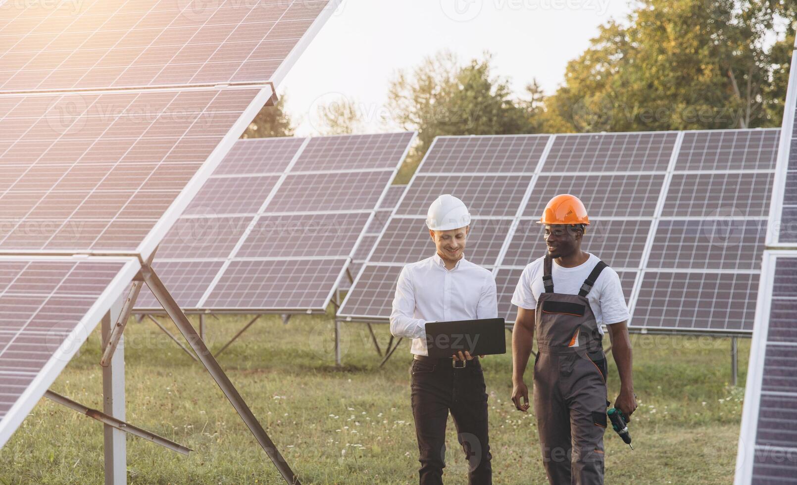 Engineers Discuss Solar Panel Efficiency at Renewable Energy Site photo