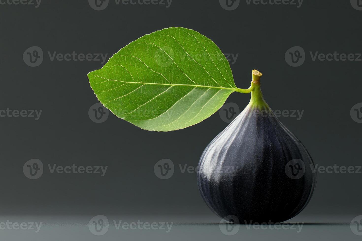 A hyperrealistic fig with glossy skin and vibrant green leaf on a minimalist dark background photo
