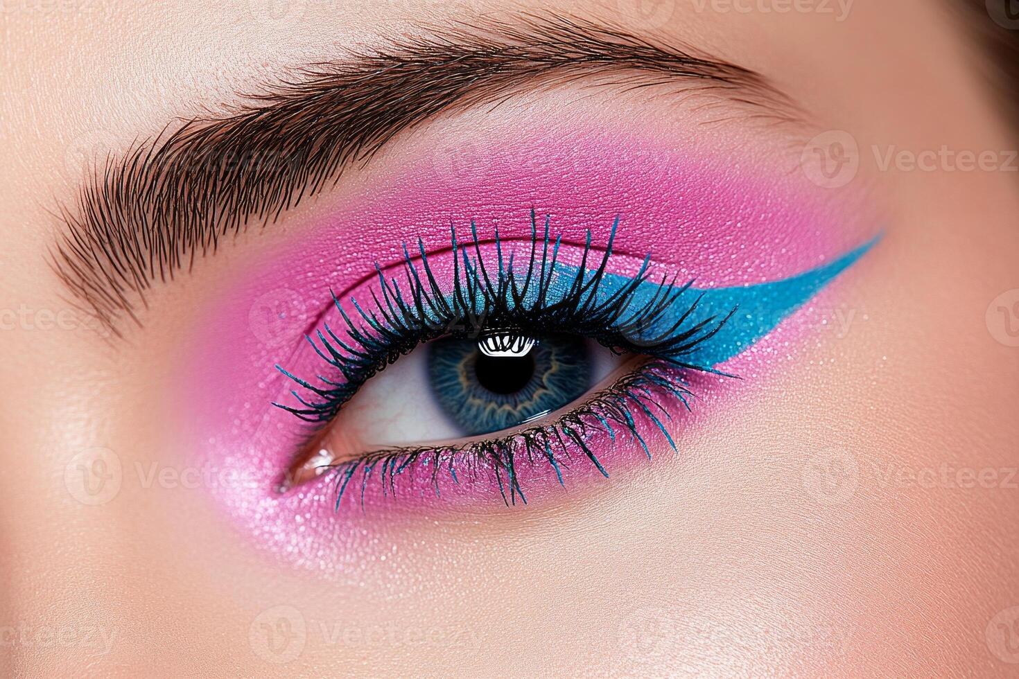 Bold makeup look featuring bright magenta and electric blue eyeshadow with turquoise eyeliner for editorial style photo