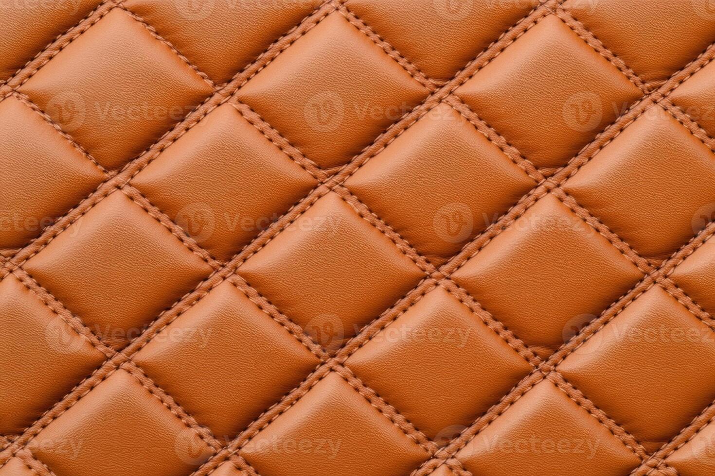 Luxurious quilted leather surface in rich brown showcasing detailed stitching and a soft texture photo