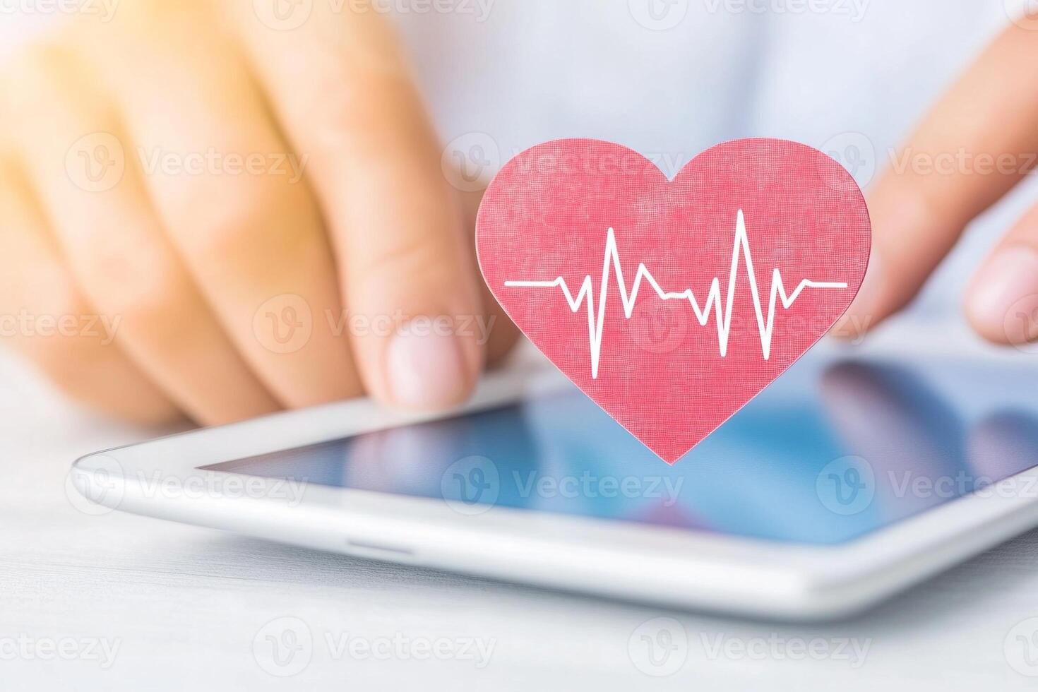 Doctor examines ECG data on tablet in a bright clinical setting showcasing modern healthcare technology photo