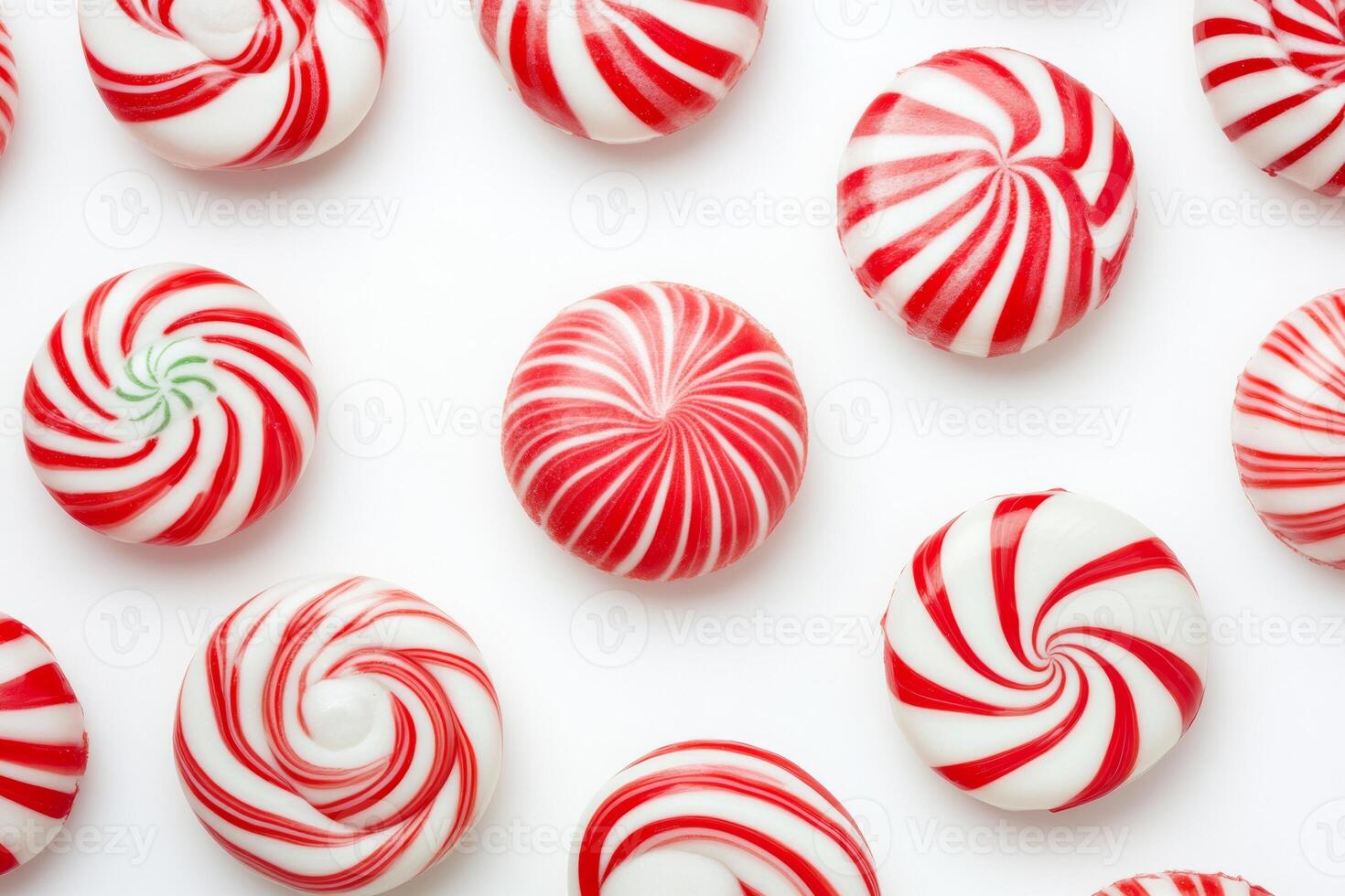 Colorful Christmas candy swirls in red and white on a bright background ready for festive celebrations photo