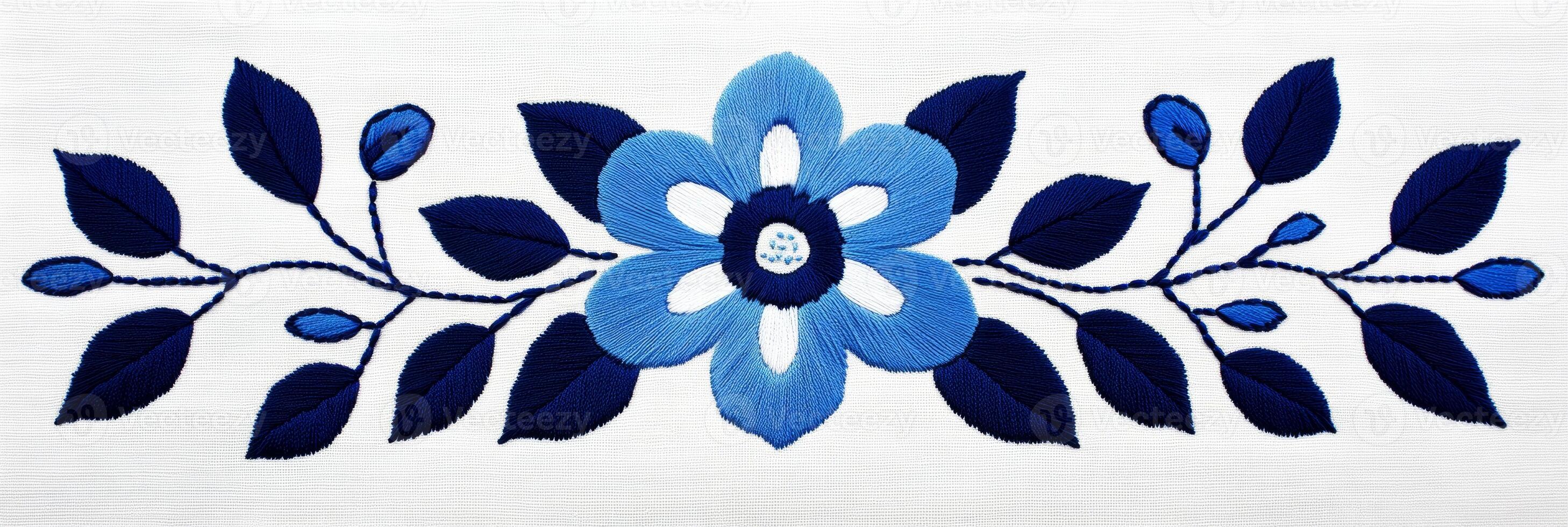 Scandinavian blue and white embroidery design featuring symmetrical flower and leaf motifs in folk art style photo