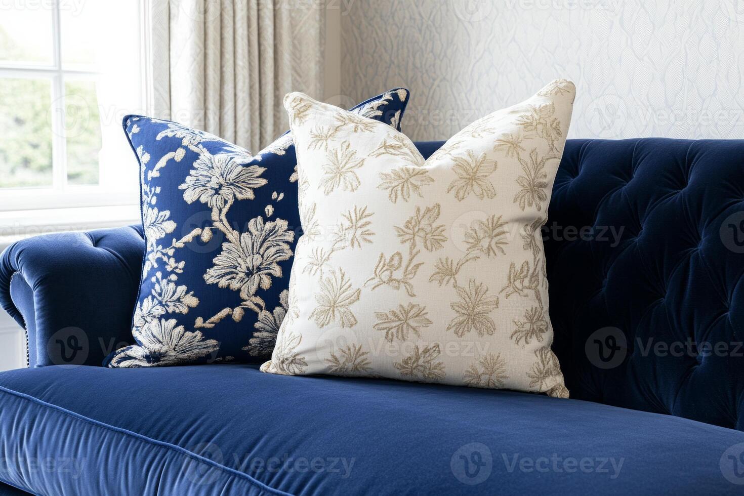 Cozy living room with soft blue-gray walls and navy sofa adorned with decorative pillows for a relaxing ambiance photo
