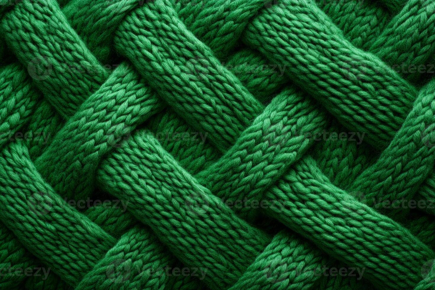 Textured green knitted background showcasing an intricate woven pattern ideal for crafting or design projects photo