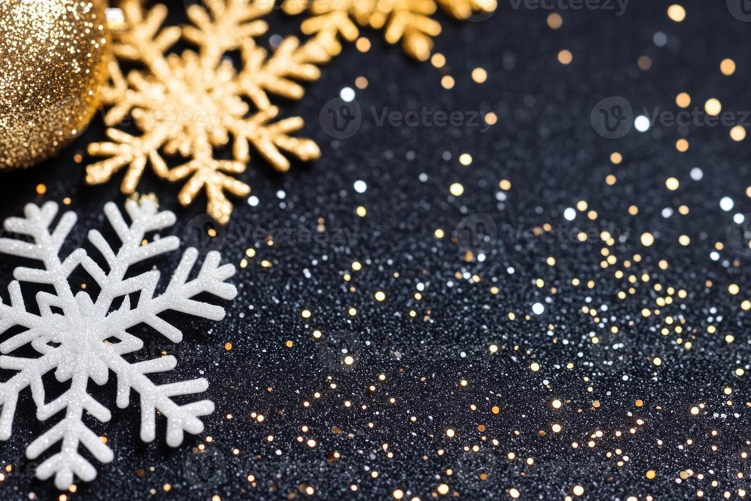 Close-up of sparkling snowflakes and festive decorations against a dark backdrop capturing winters magic photo