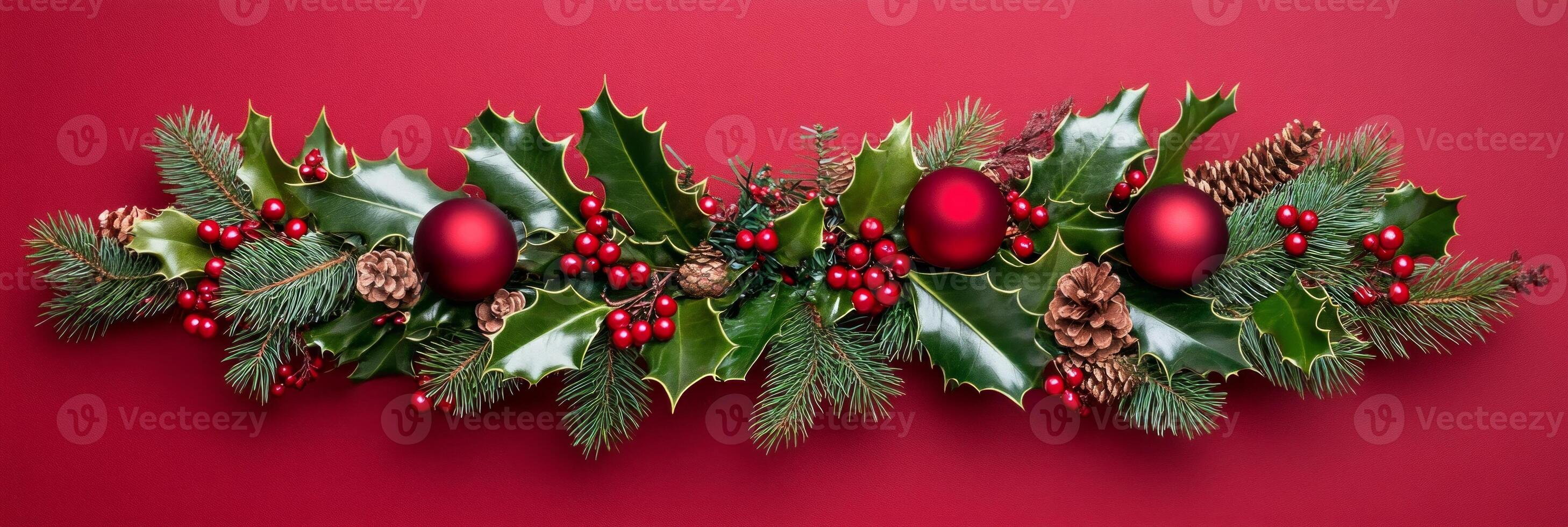 Festive Christmas wreath adorned with holly, pine needles, and red berries on a warm dark red background photo