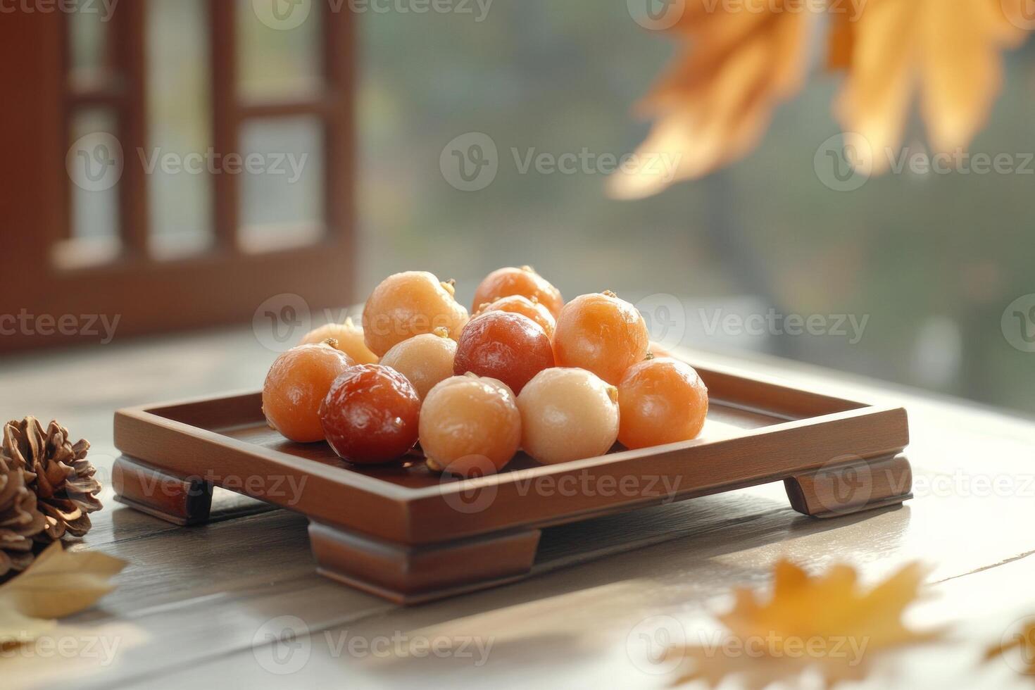 Traditional Korean dried fruit display featuring jujubes and persimmons with autumn decor in a cozy setting photo
